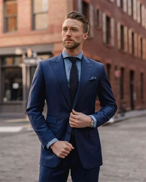 navy blue suit light tie